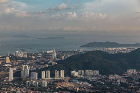Cloudy sky, cityscape and mountain with green that viewed from Penang Hill at George Town. Penang, Malaysia.の写真素材