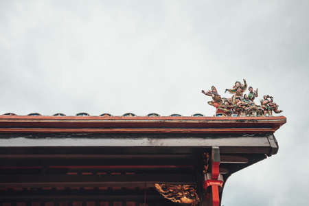 Chinese temple roof with angels statues  in Malacca City, Malacca, Malaysia.の写真素材