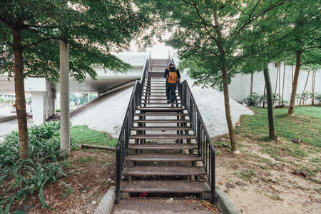 Man walking on overpass near KL Sentral in Kuala Lumpur, Malaysia.の写真素材