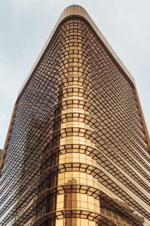 Building with golden mirror facade in Kuala Lumpur, Malaysia.のeditorial素材