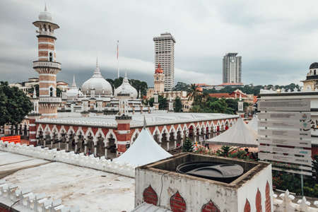 Cityscape with buildings and mosques in Kuala Lumpur, Malaysia.のeditorial素材