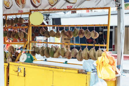 Durians for sale on the shelf in the market in Kuala Lumnpur, Malaysia.の写真素材
