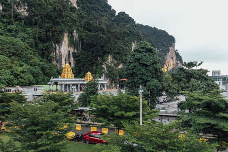 Golden pagoda with green mountain near Batu Caves near Kuala Lumpur, Malaysiaのeditorial素材