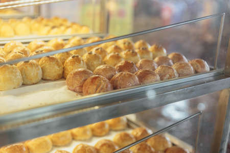 Spring Roll pastry with nuts, salted eggs for sell in the glass shelf in the market near China Town...