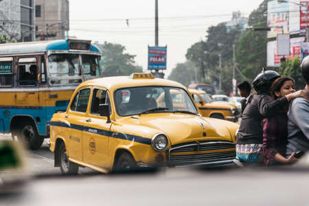 Yellow vintage taxi on the road in Kolkata, Indiaのeditorial素材