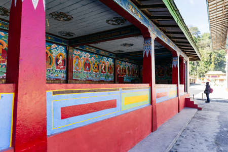 Painted Buddha images in the temple with tourist in Tibetan Buddhism Temple in Sikkim, India.のeditorial素材