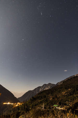 Mountain with little snow on the top with stars in the night at Lachen in North Sikkim, India.の写真素材