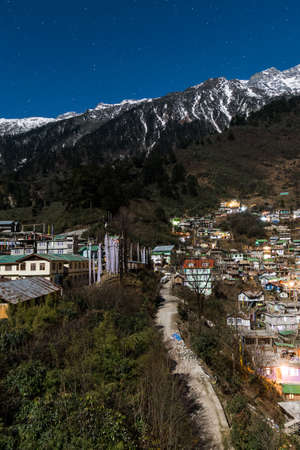 Mountain with village in the night at Lachen in North Sikkim, India.の写真素材
