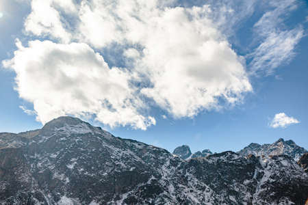 Close up shot of Black mountain with snow and cloud on the top at Thangu and Chopta valley in winter in Lachen. North Sikkim, India.の写真素材