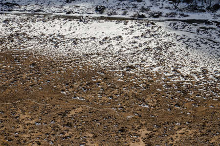 Glacial trace and snow on yellow stone ground at Thangu and Chopta valley in winter in Lachen. North Sikkim, India.の写真素材