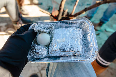 Breakfast for tourist in foiled pack included two boiled eggs and sandwitch in the background in winter in Zero Point at Lachung. North Sikkim, India.のeditorial素材