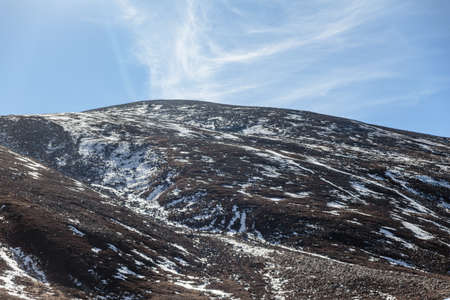Close up black mountain witn snow with cloud and blue sky in winter at Zero Point at Lachung. North Sikkim, India.のeditorial素材