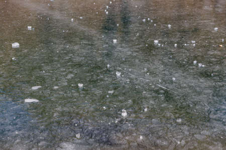Close up frozen pond with ice on the surface in winter in Tashi Delek near Gangtok. North Sikkim, Indiaのeditorial素材