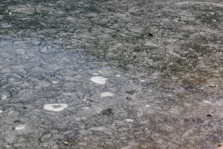 Close up frozen pond with ice on the surface in winter in Tashi Delek near Gangtok. North Sikkim, Indiaのeditorial素材