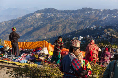 People are seeing the first light of new year's day at dawn with mountain villages and Kangchenjunga...