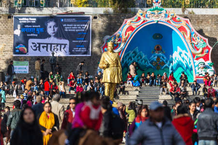 A Statue of Bhanubhakta Acharya at Chowrasta Mall with crowd of people in Darjeeling, India.のeditorial素材