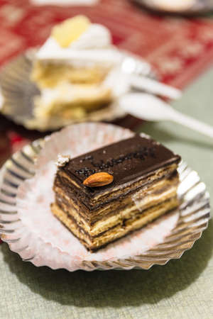 Chocolate layer cake topping with almond at cafe in winter in Darjeeling, India.の写真素材