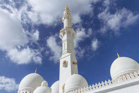 Marble pillar with domes of Sheikh Zayed Grand Mosque with blue sky in the morning at Abu Dhabi, UAE.のeditorial素材