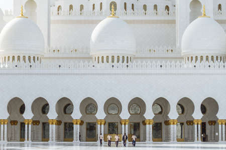 Janitor men cleaning the marble floor of  Sheikh Zayed Grand Mosque in the morning at Abu Dhabi, UAE.のeditorial素材