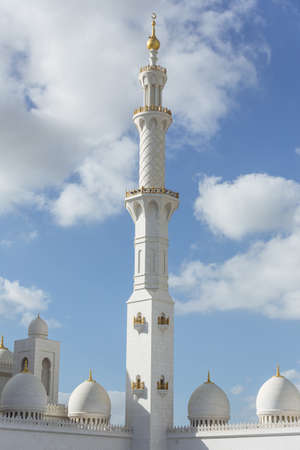 Marble pillar with domes of Sheikh Zayed Grand Mosque with blue sky in the morning at Abu Dhabi,...