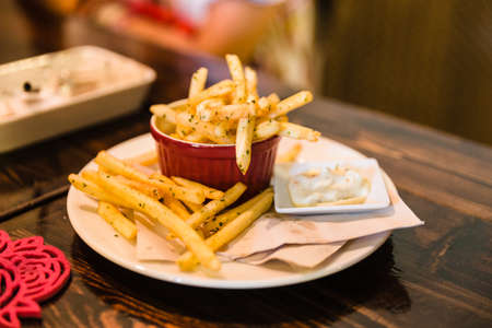 French fried sprinkled salt and minced rosemary served with mayonnaise at the restaurant in Chiang Mai, Thailand.の写真素材