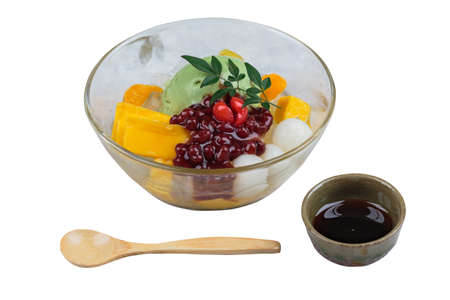 Isolated Matcha (Green Tea) ice cream served with jack fruit, lychee, orange, coconut jelly and red bean paste.の写真素材