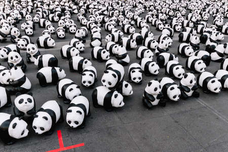 Many panda sculptures view from above that place on the floor is an art exhibition in Bangkok, Thailand.のeditorial素材