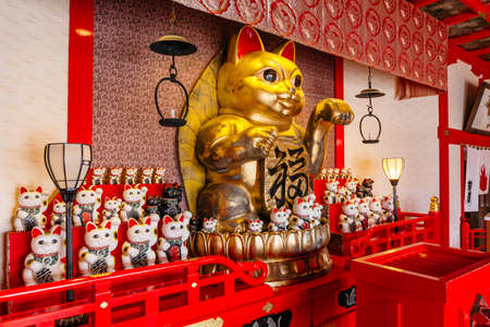 Fortune cats (Nameki Neko) in temple in Noboribetsu Date JIdaimura Historic Village at Hokkaido, Japan.のeditorial素材