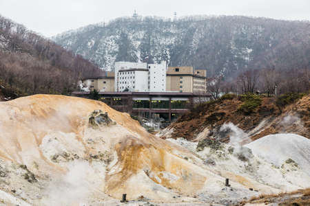 Noboribetsu Jigokudani (Hell Valley) with hotel and mountain: The volcano valley got its name from...
