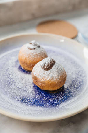 Bombolone is an Italian filled doughnut and is eaten as a snack food and dessert.の写真素材