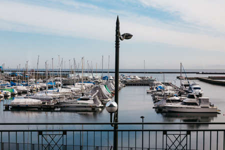 Yachts bay with floated yachts on the river in winter in Hokkaido, Japan.のeditorial素材