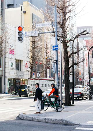 Sapporo cityscape with buildings, road, cars and walking people in Hokkaido, Japan.のeditorial素材