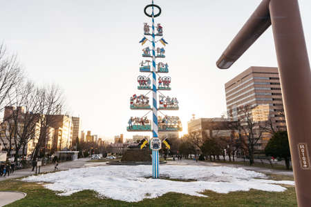 Christmas tree on the ground with pile of snow at Sapporo in Hokkaido, Japan.のeditorial素材