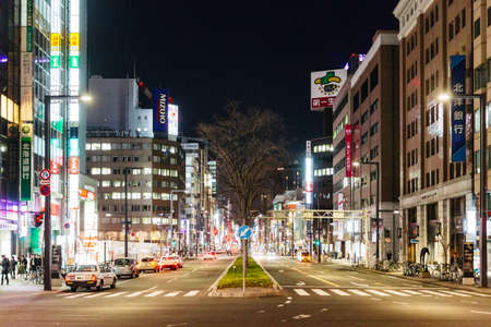 Sapporo night cityscape with road and buildings in Hokkaido, Japan.のeditorial素材