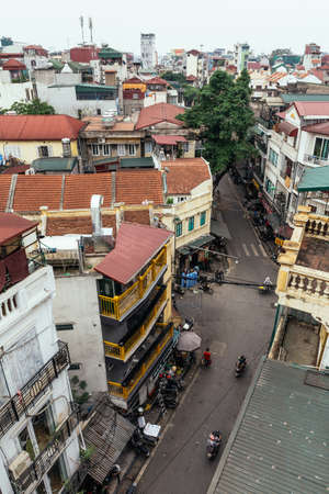 Cityscape including houses, buildings and street with bicycles that view from rooftop in Hanoi, Vietnam.のeditorial素材
