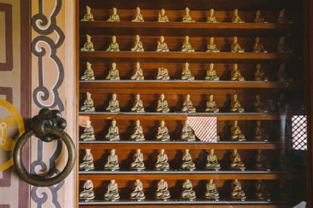 Small golden Buddha statues inside Yakcheonsa Temple. Jeju, South Korea.のeditorial素材