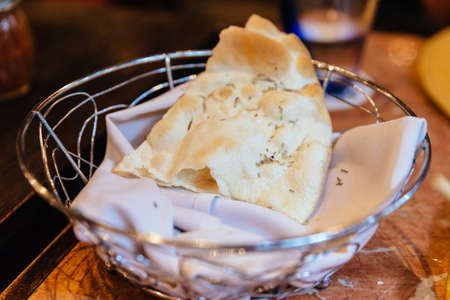 Italian fresh baked Piadina in basket. Served as appetizer.