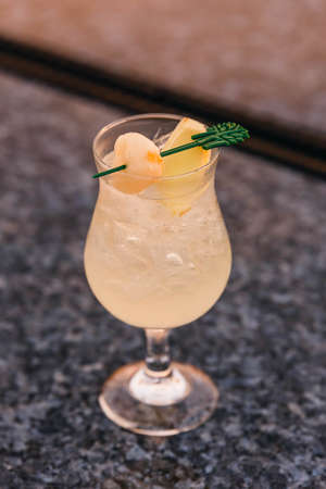 White iced cocktail with lychee and sliced of lemon.の写真素材