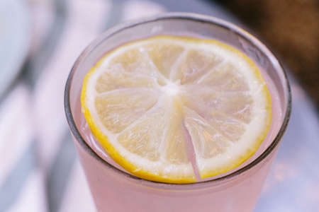 Close up Sweet refreshing fruit punch topping with a sliced of lemon.の写真素材