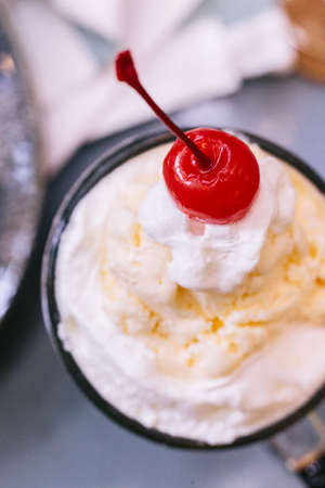 Close up Sweet refreshing Cherry Cola topping with a scoop of vanilla ice cream and fresh cherry.の写真素材