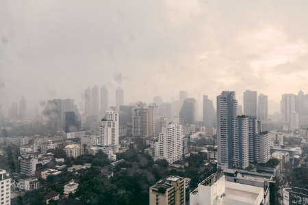 Rain over Bangkok: Cityscape and cloud while raining in the evening.の写真素材