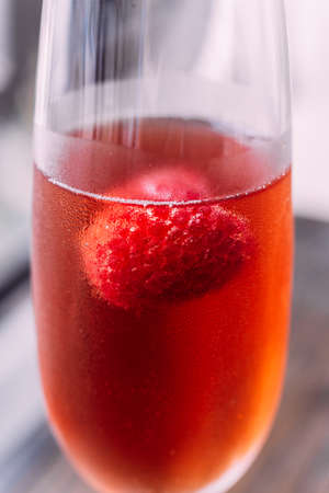 Close up Red cocktail with raspberry inside in glass wine.の写真素材