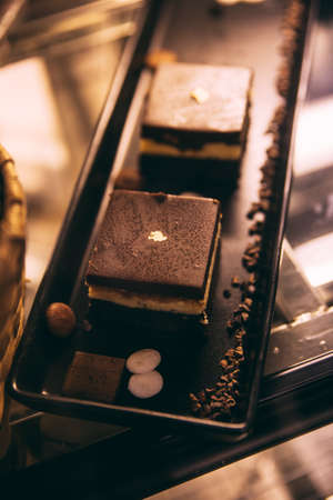 Tiramisu is a coffee-flavoured Italian dessert on black tray that ready for sell.の写真素材
