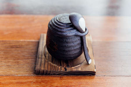 Japanese Caramel Pudding served in black ceramic cup.の写真素材