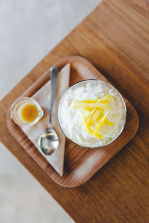 Lod Chong, Thai melon, puffed rice with coconut snow ice topping with sliced jackfruit. Served with caramel.の写真素材