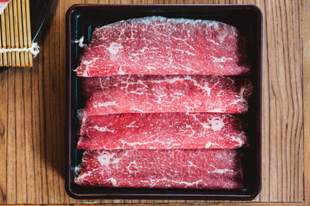 Rare slices authentic A5 Grade Japanese Wagyu beef with high-marbled texture for Shabu.の写真素材
