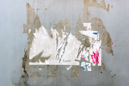Sticker trace and glue trace on grey wall texture. Perfect for background.の写真素材