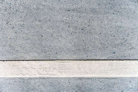 Outdoor road with white line marking on the bottom texture. Perfect for background.の写真素材