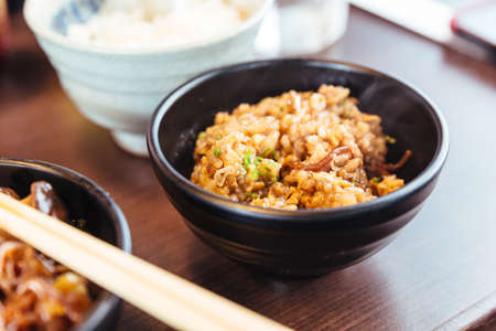 Rice stir fried with sukiyaki soup. Salty-sweet flavors of Shoyu sauce, Wagyu beef, pork and vegetables from sukiyaki hot pot.の写真素材