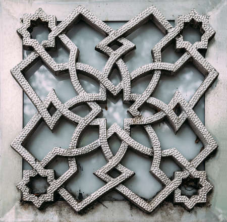 Muslim geometric art in square pattern that made of metal.